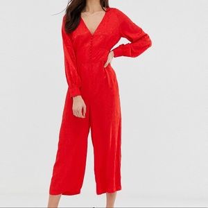 Red jumpsuit with waist detail (never worn)